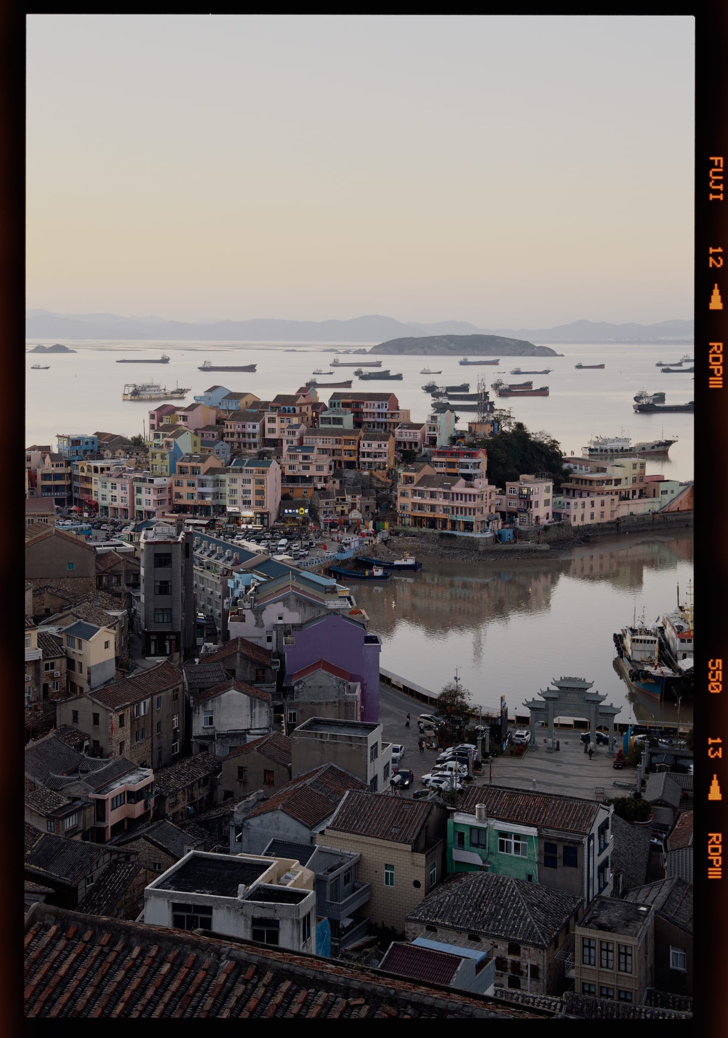 A fishing harbour at dusk on Fujifilm Provia 100F, 6×9, with the FUJI RDP III edge print.